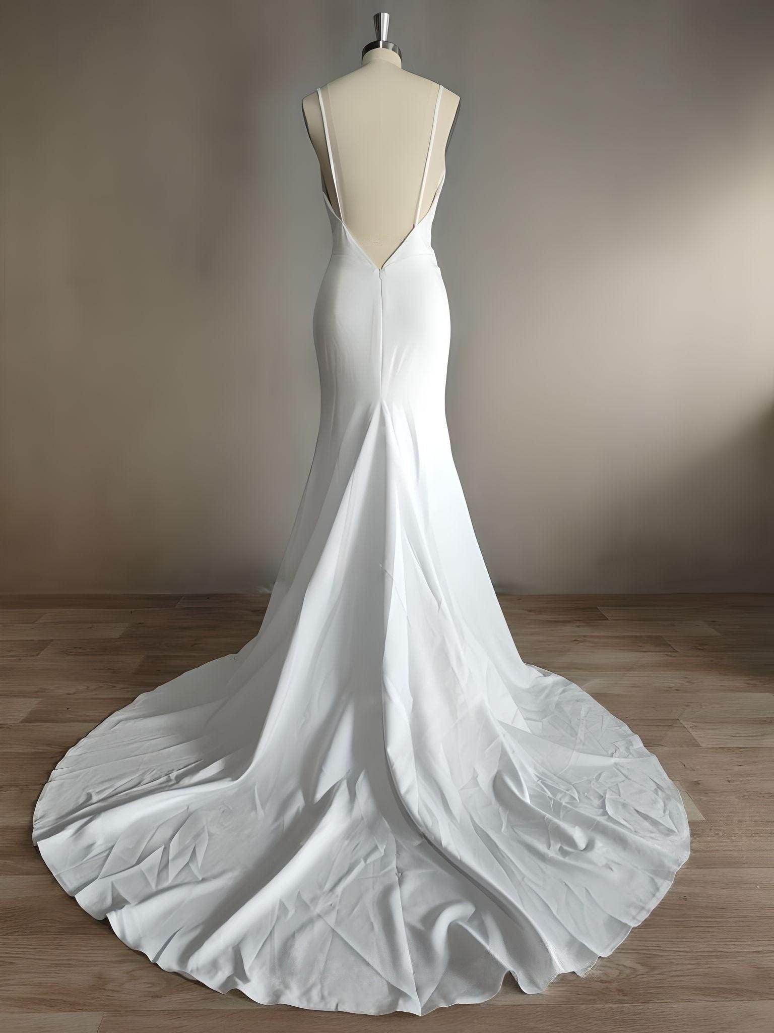 Spaghetti Straps Elegant Wedding Dress - Backless Wedding Gown with a train on a tailor figurine