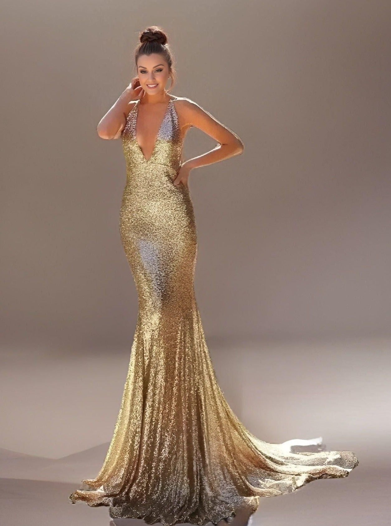 Smiling woman feeling sexy in Gold Sequined Backless Evening Gown with V Neck
