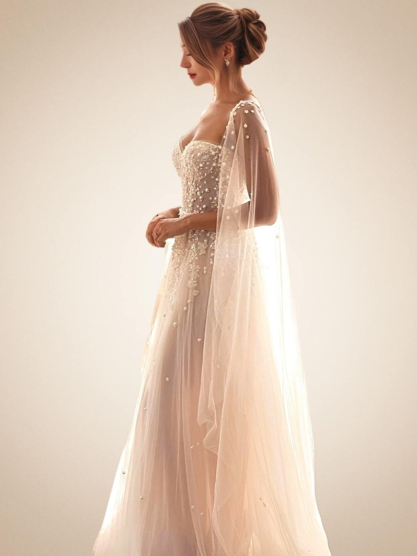 Woman in Discover elegance in our modern lace and pearl appliqued wedding dress