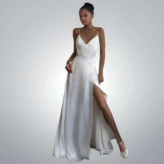 Bride in simple elegant spaghetti strap wedding dress with slit - front view
