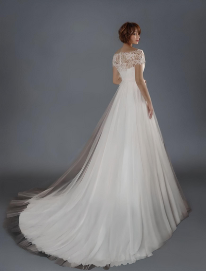 Bride from back in Anastasia Maternity Wedding Dress with Sweep Train and Lace Applique Top