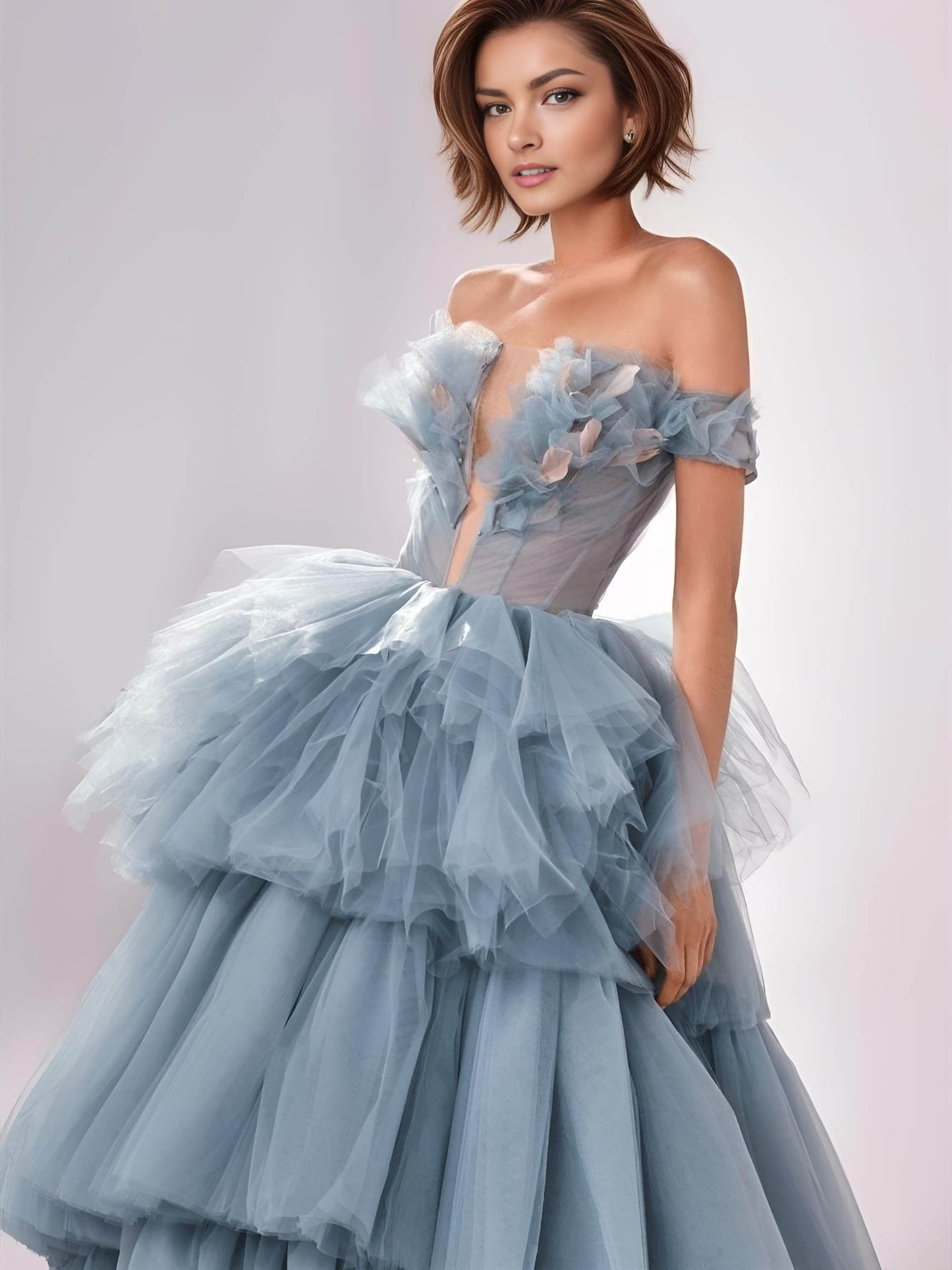Woman wearing tiered blue tulle formal dress with interesting pink accent neckline