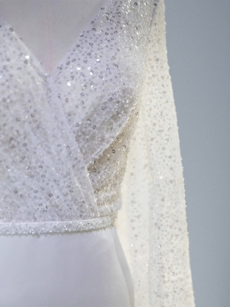 Detail of wedding dress sequined pleated ace top.