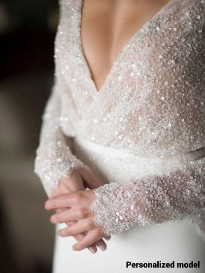Detail of women wearing top lace sequined dress.