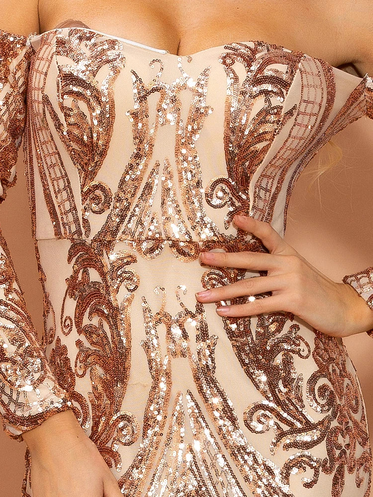 Close-up of a person wearing a rose gold sequin dress with intricate patterns.