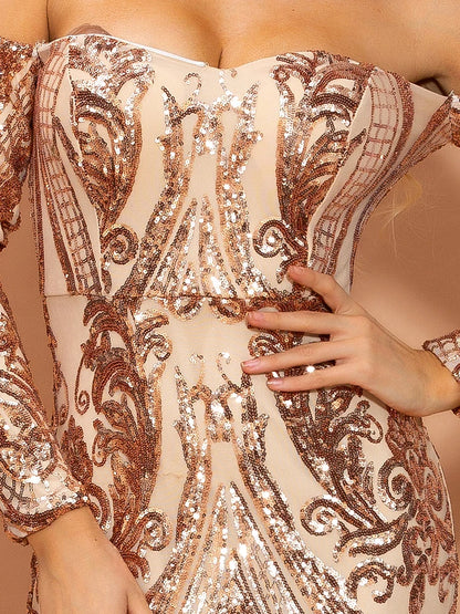 Close-up of a person wearing a rose gold sequin dress with intricate patterns.