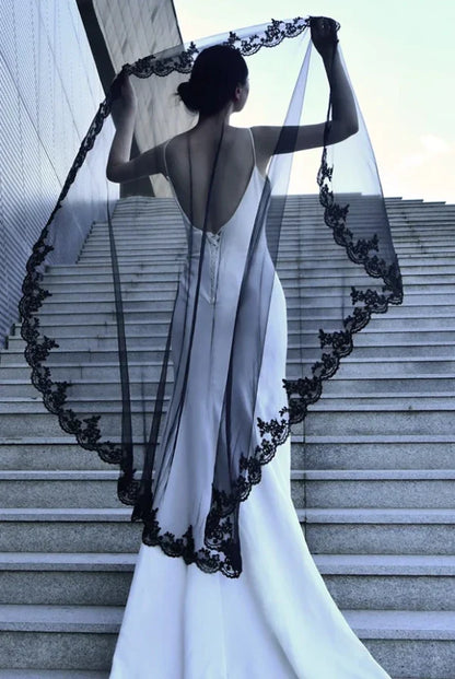 white wedding dress with black veil A a gown? That's what we call a statement piece Bride: @risss926 Gown: @allwhowander Jax #bride #wedding #bridefashion # weddingdress #fashion add other embellishments Black and White Veil and