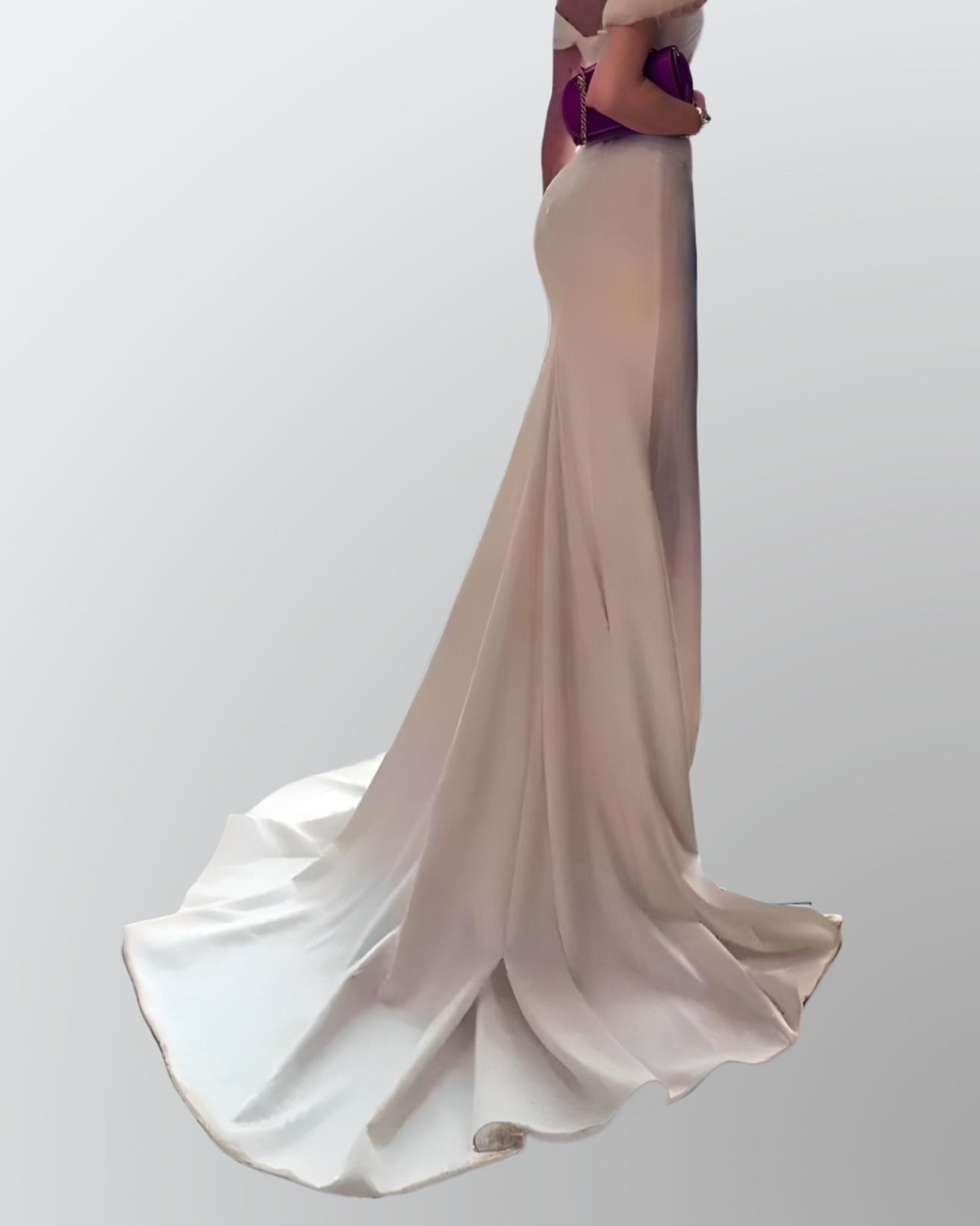 Bride showcasing a fitted mermaid gown in satin, emphasizing the elegant and graceful sweep train.