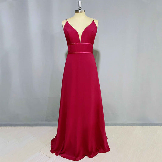 Store mannequin showcasing red A-line gown with spaghetti straps, a V-neckline, perfect for bridesmaids or prom.