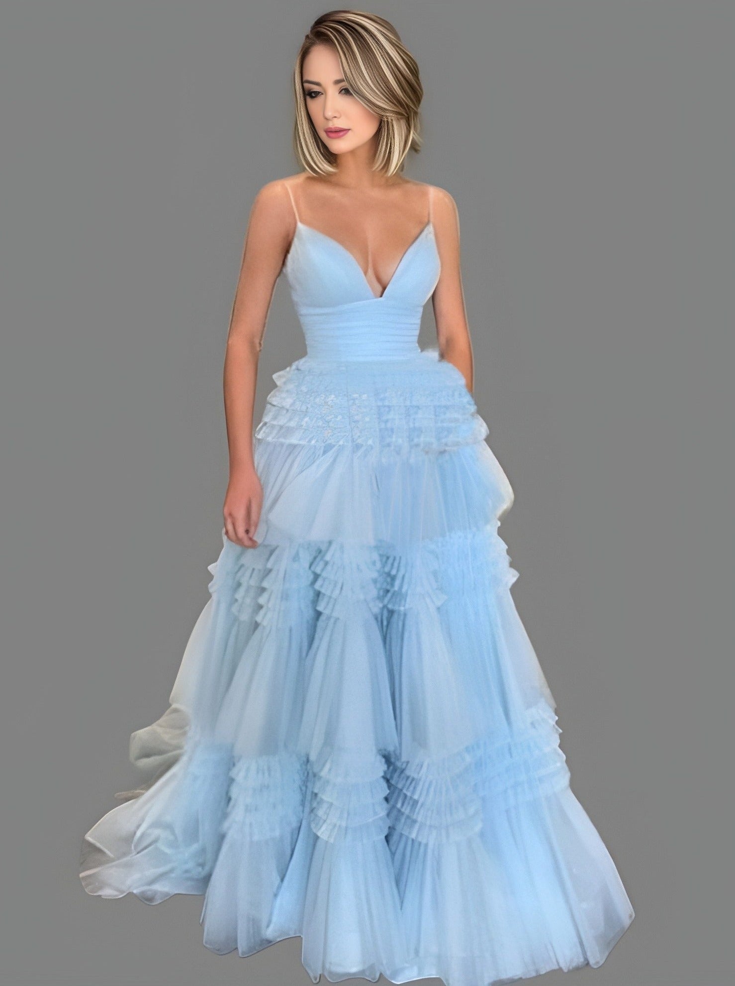 Woman wearing evening LAYLA dress, emphasizing the flowing tulle layers and tiered design.