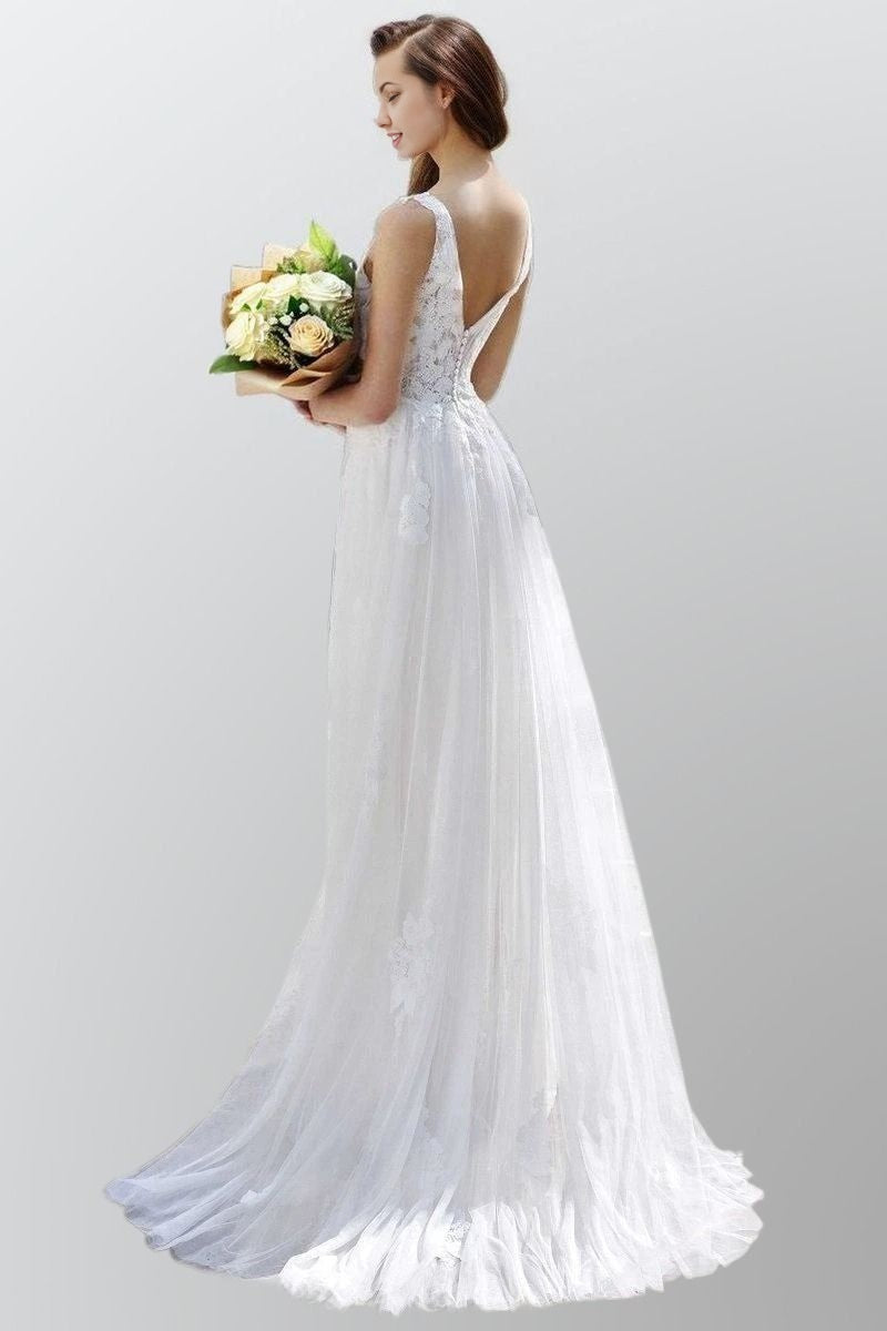 Back view of bride wearing LISA dress with open V-back in soft tulle.
