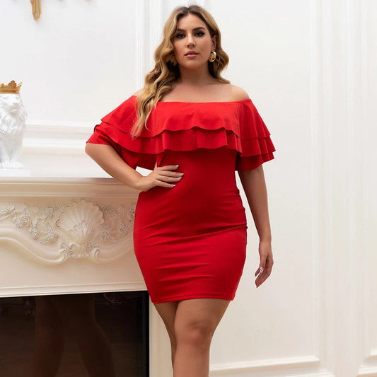 Elegant woman posing in bright red MACIE mini dress with tiered neckline.