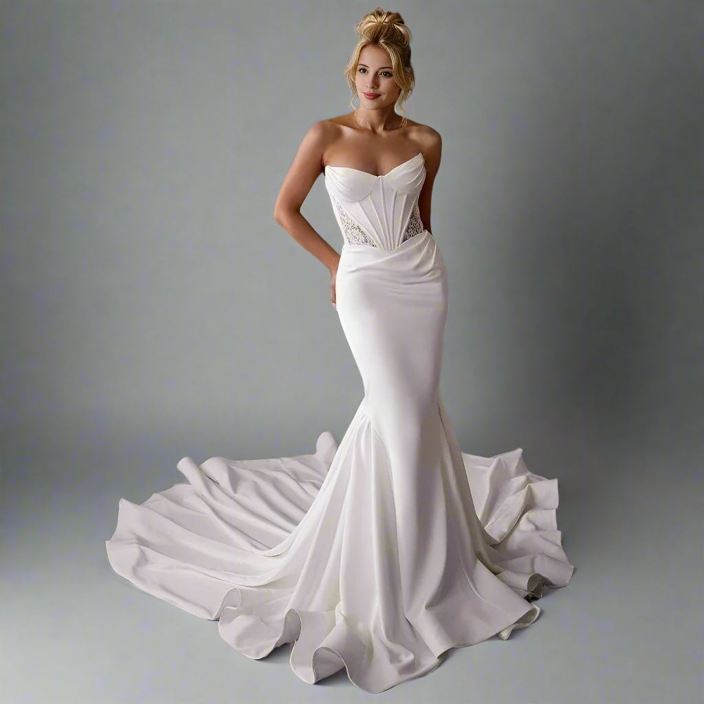 Bride in elegant satin mermaid wedding dress – Oleandra with pleats and see trough lace on bodice and sweetheart neckline.