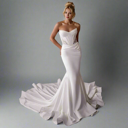 Bride in elegant satin mermaid wedding dress – Oleandra with pleats and see trough lace on bodice and sweetheart neckline.