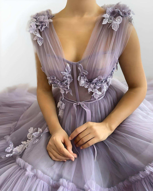 Close-up of 3D flower tulle appliques and neckline on purple formal dress