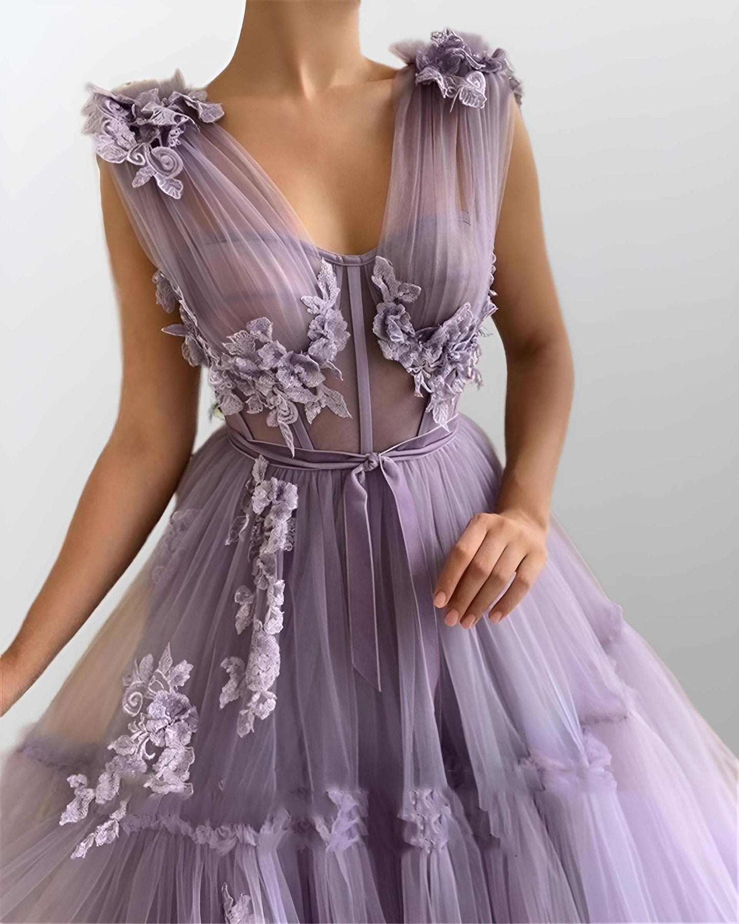 Detail of tulle fabric and 3D flower appliques on purple RAQUEL formal dress.