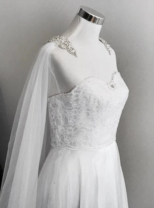 White Rhinestone Brooch Shoulder Cape Veil on a mannequin.