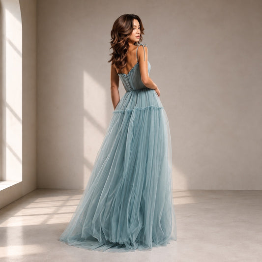 Back view showing the zipper closure of the dusty blue SARKA tulle pleated formal dress.