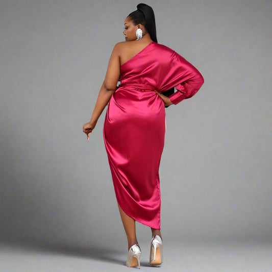 Back view of the SASKIA dress, showing the clean lines and elegant pleats.