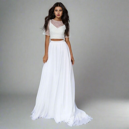 Bride wearing lace short sleeve crop top with flowing chiffon skirt