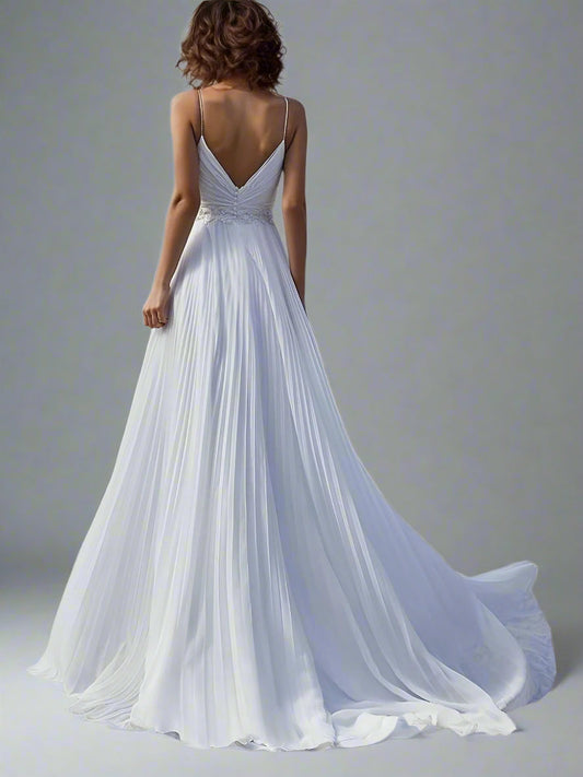 Back view of the Shyla Wedding Dress, highlighting the flowing chiffon fabric and deep V back backless design.
