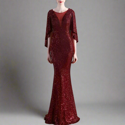 Woman wearing long formal burgundy sequin dress.
