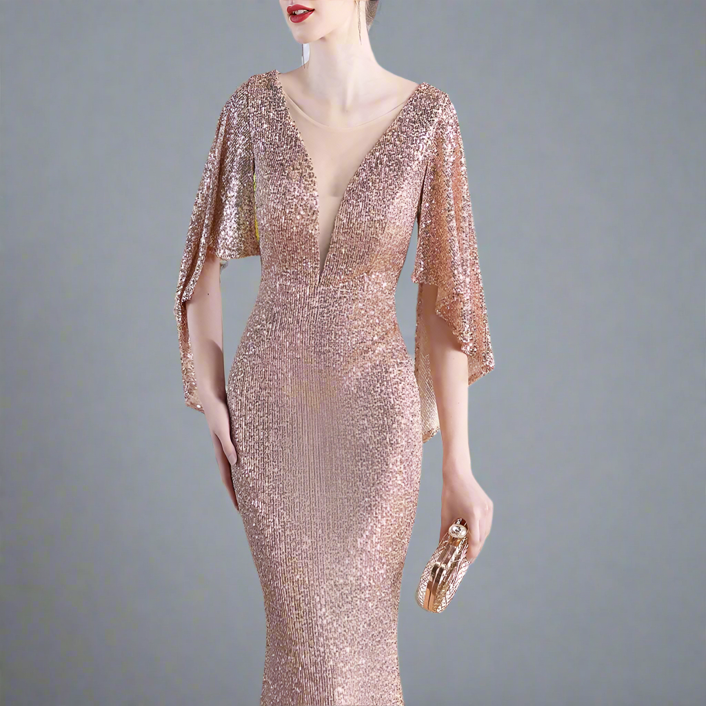 Woman wearing a rose gold sequin dress.