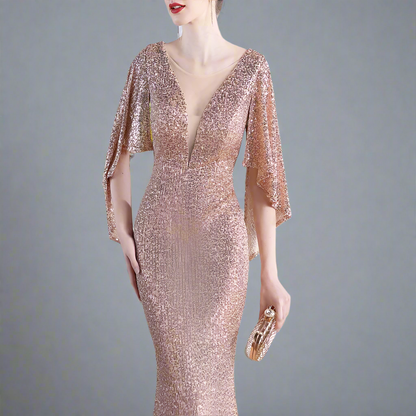 Woman wearing a rose gold sequin dress.