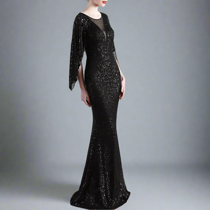 Black sequin evening gown with long sleeves in an studio setting