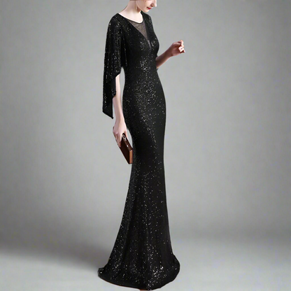Woman wearing a black elegant mermaid sequin dress holding a clutch.