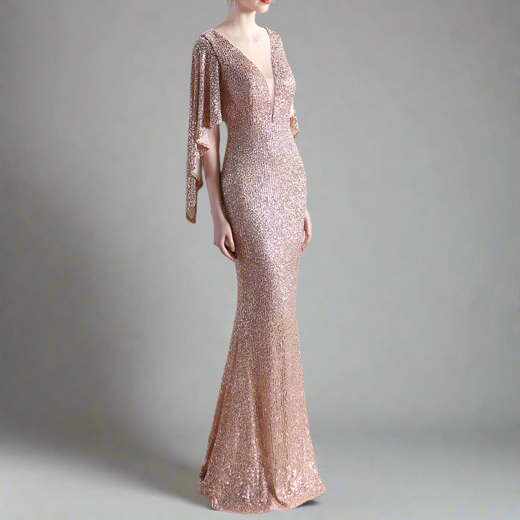 Woman wearing a sparkly gold evening gown.