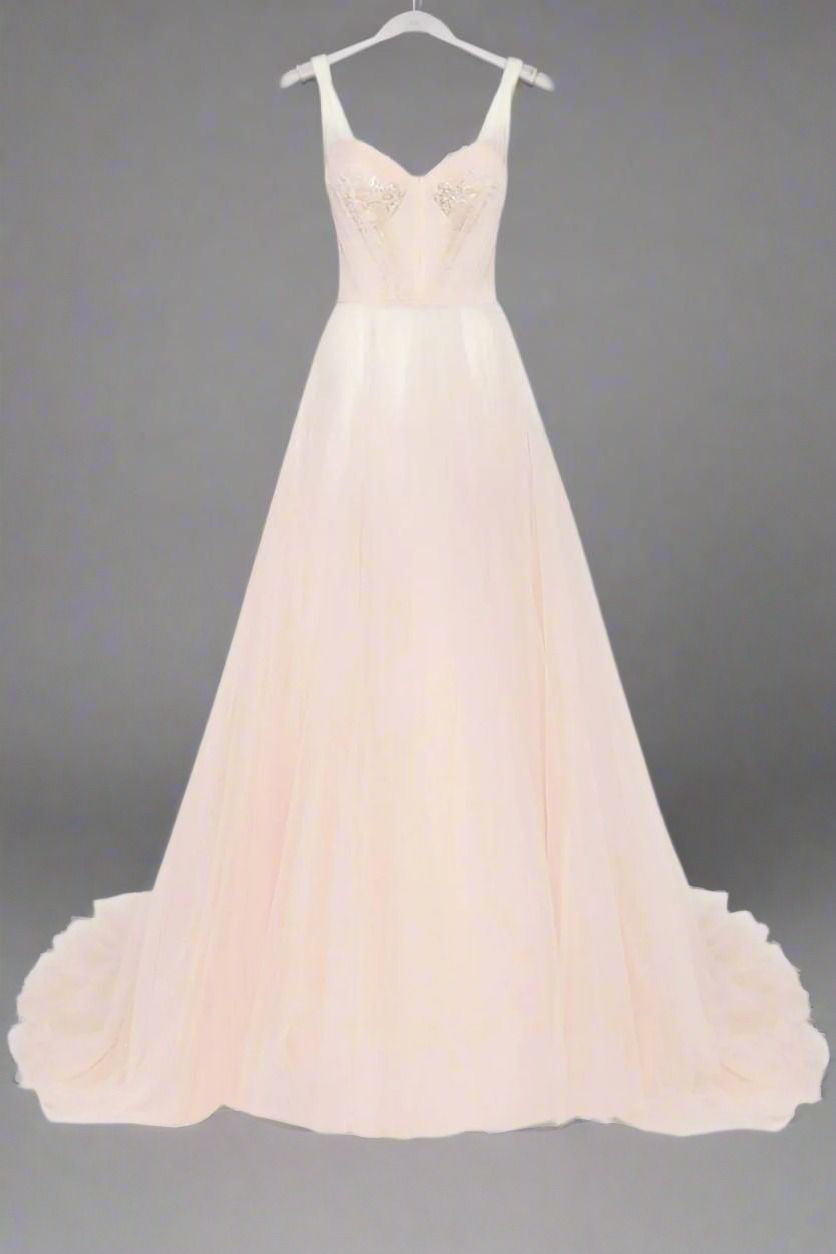 Sweetheart neckline floor-length formal evening dress in pink with embroidered lace details and tulle skirt.