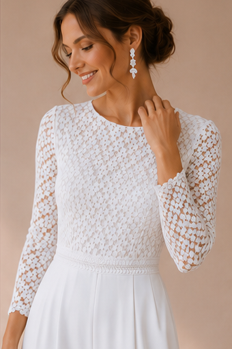 Detail of white lace jumpsuit worn by a model 