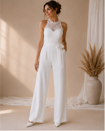 Bride wearing a white lace jumpsuit  with waist bow