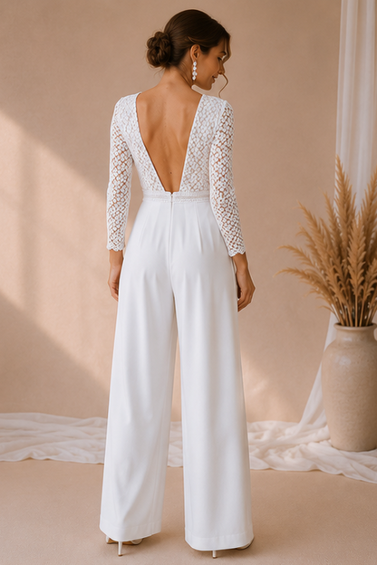 Woman wearing a white lace jumpsuit with a beige background