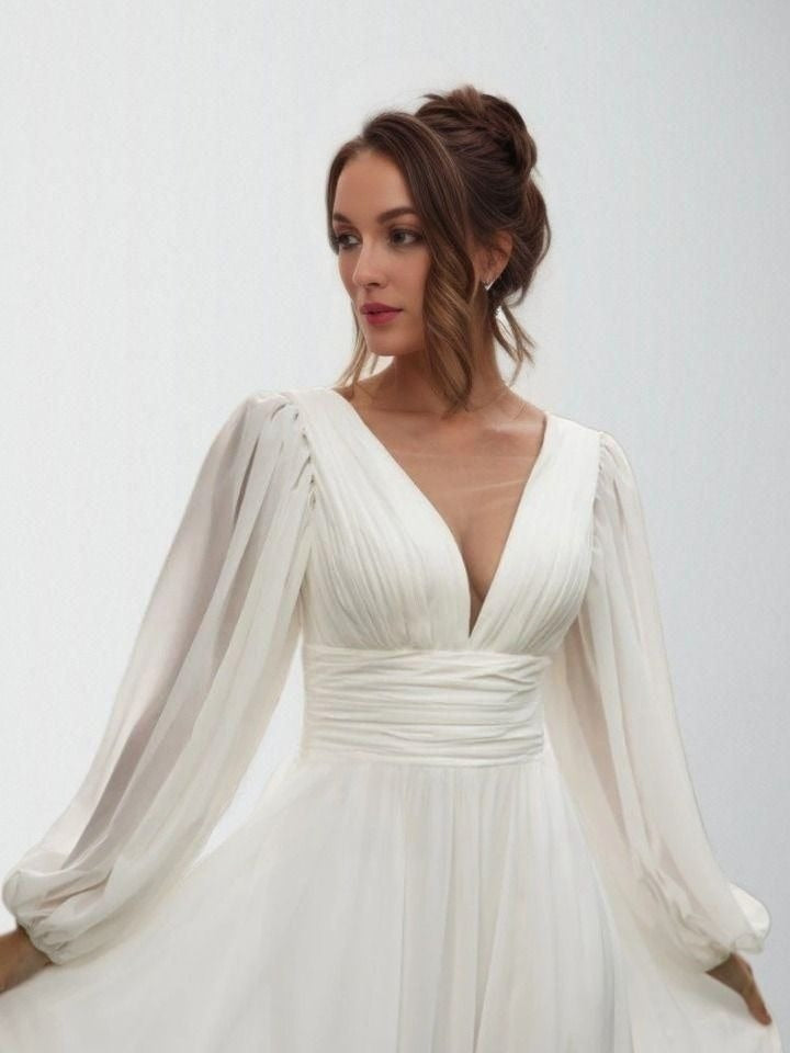 Detail of model wearing V-Neckline Pleated Wedding Dress with Puff Sleeves