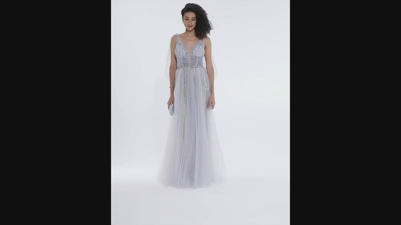 Woman with afro hairstyle twirling in blush silver A-line wedding gown with beaded bodice