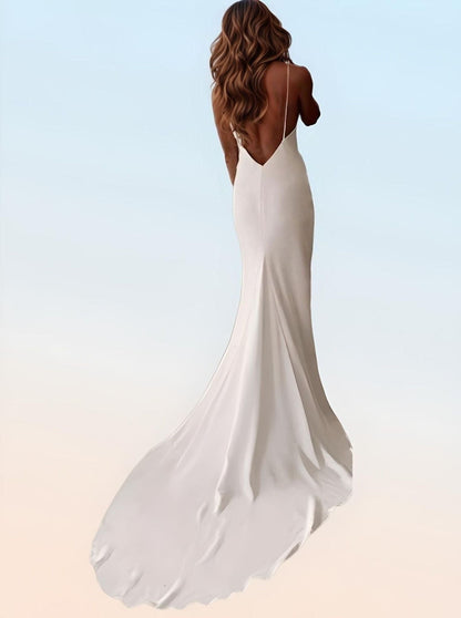 Bride in backless simple wedding dress with deep low back cut